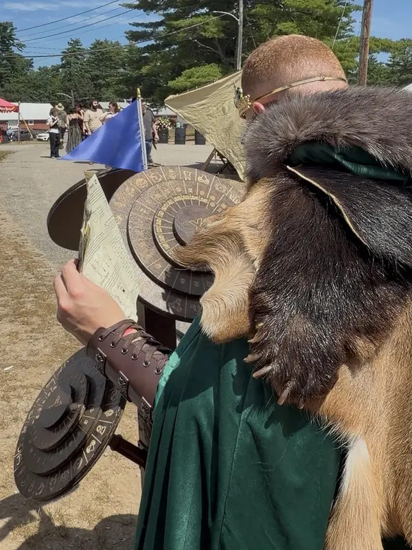 A player in a fur mantle holding up the quest sheet at the cipher wheels
